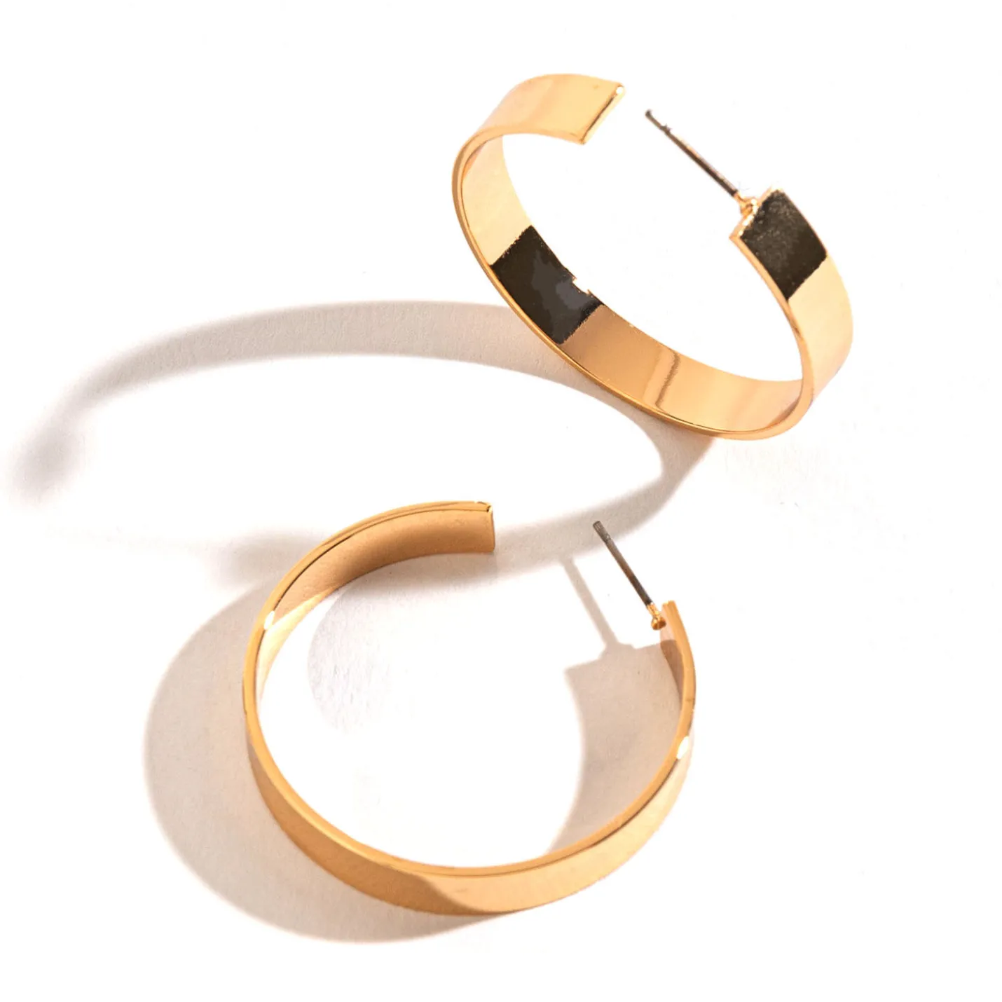 Howard's Jewelry Large Flat Gold Hoop Earrings